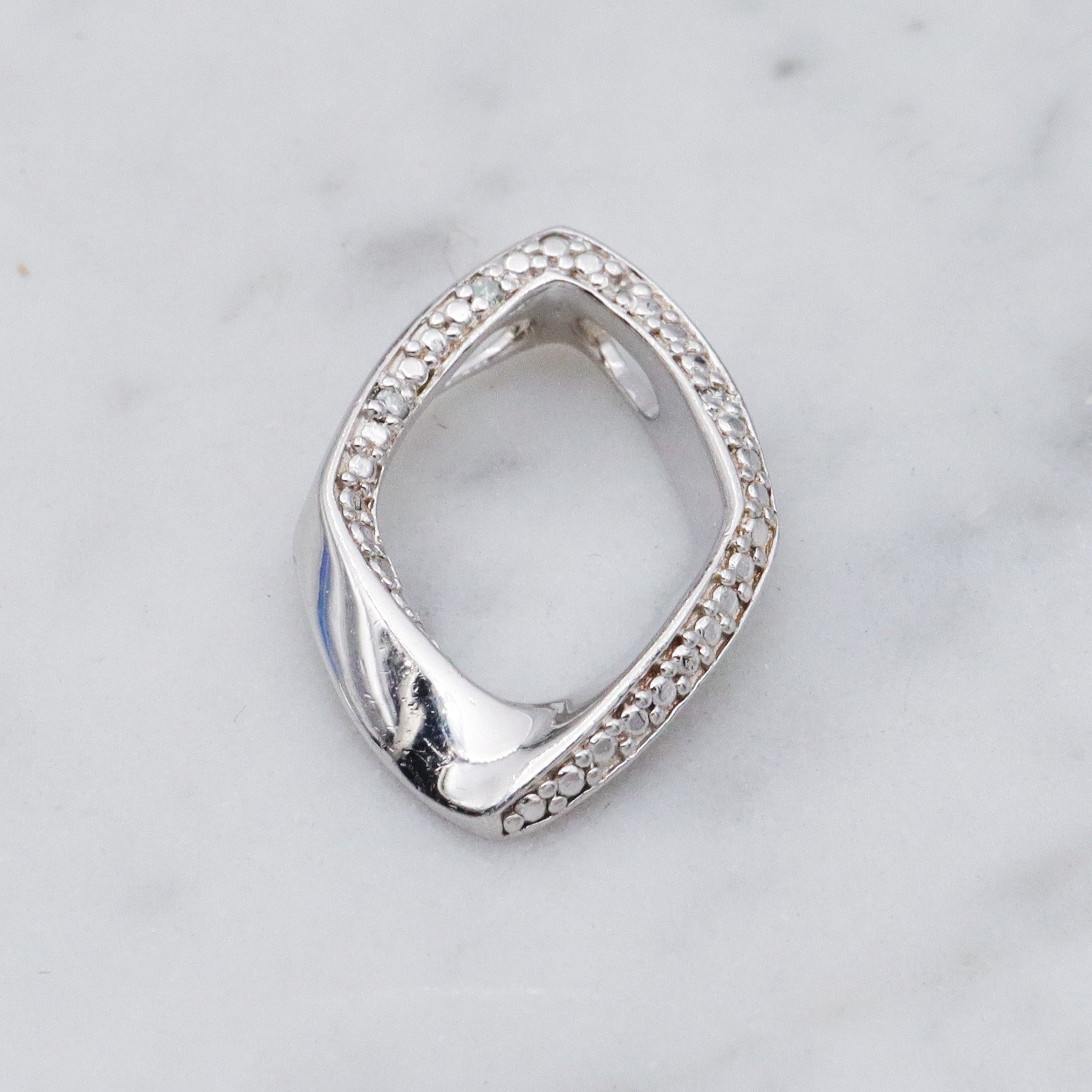 Vintage sterling silver and diamond abstract pendant